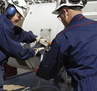 Men Working On Equipment